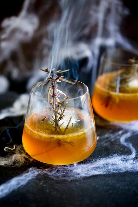 For a simple bourbon based cocktail, why not try this Haunted Graveyard Halloween cocktail. It is perfect for a fall or halloween party as it combines, bourbon and maple for a warm you up drink. Plus the creepy smoking rosemary adds a bit of  spooky fun to your drink. Everyone loves a bit of theatre and this maple, bourbon and orange cocktail is sure to impress. #fallcocktail #halloweencocktail #bourboncocktail Halloween Alcohol, Cocktail Halloween, Graveyard Halloween, Haunted Graveyard, Halloween Drinks Alcohol, Vegan Halloween, Orange Cocktails, Halloween Cocktail, Halloween Food Ideas