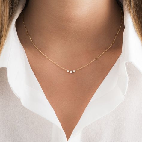 Our delicate round diamond necklace makes the perfect accessory! This dainty diamond necklace features 3 round brilliant cut prong set diamonds along with a sturdy 1.3mm cable chain and spring clasp for additional security. Our meaningful diamond necklace is available in three different 14K Gold colors: White Gold and Yellow Gold. ✨ Features ✨ • Ready To Ship. • Made in the USA.• Gold : Solid 14K• Choice of Gold: Yellow Gold, White Gold• Diamond Cut: Round • 3 VS quality Genuine Diamonds• Packag Dainty Gold Necklace Simple & Dainty Jewelry, Round Diamond Necklace Settings, Earring Necklace Ring Set, Fine Necklace Gold, Small Diamonds Necklace, Minimalistic Diamond Necklace, Simple Gold Diamond Necklace, Dainty Everyday Necklace, Dainty Gold Jewellery