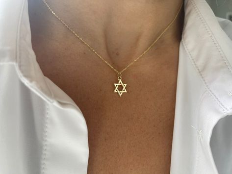 Star of David Necklace / 14k Gold Star of David Necklace / Small Star of David Pendant  this listing is for one star of David this is available with or without a chain. Please choose accordingly at check out. SOLID 14K YELLOW GOLD STAR OF DAVID NECKLACE . THE STAR AND CHAIN IS SOLID 14K YELLOW GOLD.  FREE SHIPPINGWITHIN THE USA METAL: 14k solid gold 585  STYLE: STAR OF DAVID NECKLACE PURITY: 14K SIZE: 11.5 mm AS IT IS WITH THIS ITEM ALL MY PIECES ARE HAND MADE. AND I STAND BEHIND EVERY PIECE. SA