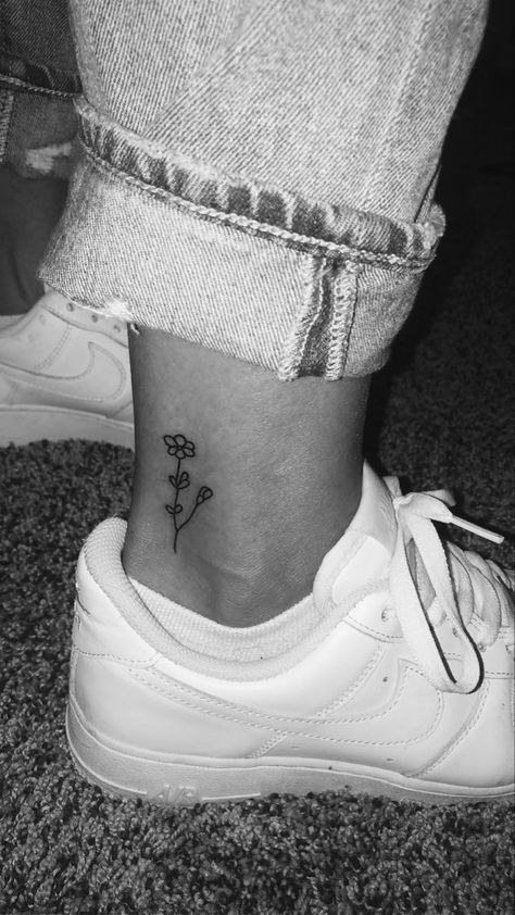 Ankle tattoo
Flower tattoo 
Small Ankle Simple Tattoos, Tattoo Ideas Female Small Ankle, Tattoo Ankle Ideas Female, Small Flower Tattoos On Ankle, Cute Simple Ankle Tattoos, Flower Tattoo On Ankle For Women, Small Daisy Tattoo Ankle, Dainty Flower Ankle Tattoo, Tattoo Ideas Small Ankle