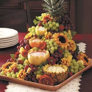 fruit display....it really doesn't look that hard, Laurie...swap out the sunflowers, of course.  (: Fruit Cascade, Pizza Reception, Desert Station, Fruit Presentation, Luau Ideas, Wedding Foods, Luau Party Ideas, Fruit Centerpieces, Fruit Platters