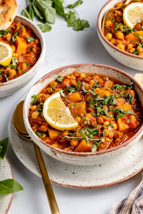 Cozy vegan Moroccan stew simmered with spices, tender butternut squash and protein-packed chickpeas & lentils. This incredible, healthy Moroccan stew recipe makes a wonderful plant based dinner the whole family will love. Serve with naan for the perfect meal! #moroccanstew #chickpeas #lentils #vegan #plantbased #stew #moroccanfood #vegetarian #glutenfree #healthydinner One Pot Vegetarian Meals, Dairy Free Fall Recipes, Recipe With Chickpeas, Healthy Fall Soups, Chickpea Lentil, Moroccan Stew, Lentils Vegan, One Pot Vegetarian, Ambitious Kitchen