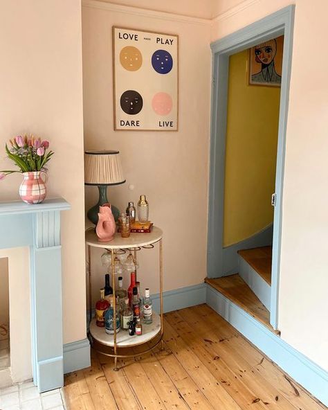 Maximalism Entryway, Small Flat Renovation Ideas, Colourful Conservatory, Pink Woodwork, Pink And Blue Hallway, Coloured Woodwork, Yellow And Blue Hallway, Pink Skirting Boards, Yellow Skirting Boards