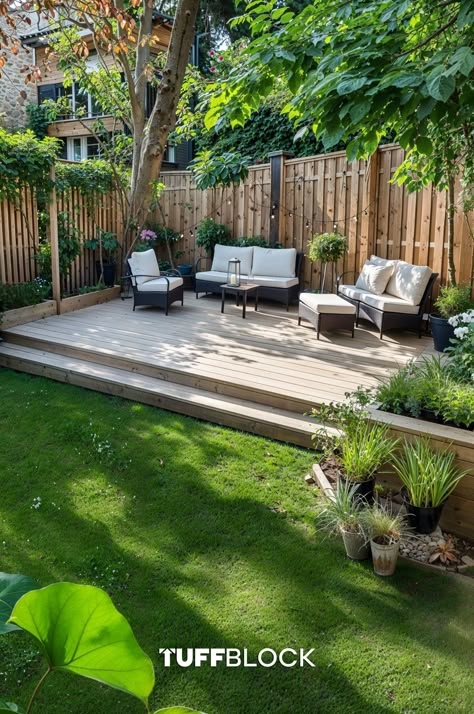 a beautiful yard with lush grass and a low level ground deck at the end, with outdoor furniture On Ground Deck, Ground Level Deck Ideas On A Budget, Deck On The Ground, Simple Deck Ideas, Small Yard Patio, Garden With Decking, Decking Ideas Garden, Simple Backyard Ideas, Build A Floating Deck