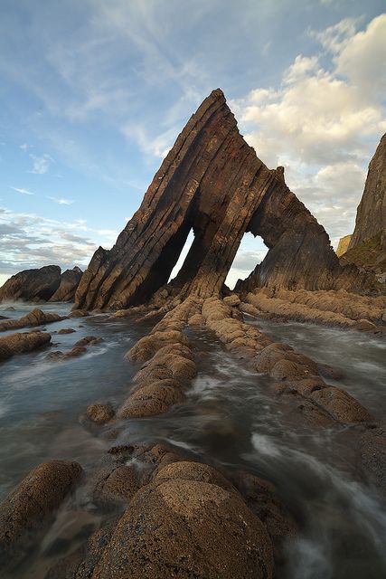 Blackchurch Rock is a spectacular rock formation on the Culm Coast near Hartland in North Devon Devon Uk, North Devon, Rock Formations, Devon, The Ocean, Water