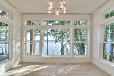 Coastal Waterfront | Coastal Waterfont Windows You Can See Out But Not In, Window With Transom Above, Lake View Windows, Picture Window With Side Windows, Sunken Sunroom, Huge Windows Living Room, Beach House Windows, Large Living Room Window Ideas, Stacked Windows