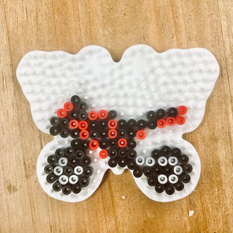 Motorcycle pattern on a butterfly hama bead board. 🏍 #hamabeads #motorcycle #motorbike #butterfly Perler Bead Motorcycle, Hama Beads Patterns Butterfly, Motorcycle Perler Beads, Peeler Bead Keychain, Motorcycle Pixel Art, Melting Beads Patterns, Art Perler Beads, Motorcycle Wheelie, Perler Beads Pattern