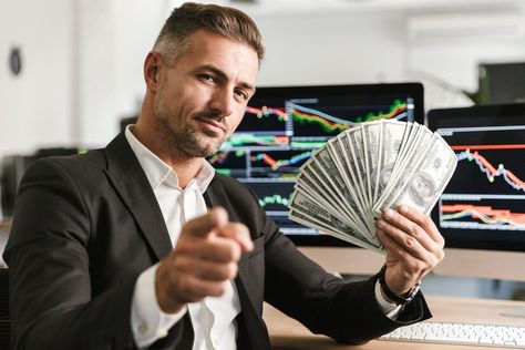 Premium Photo | Image of pleased businessman 30s wearing suit holding money fan while working in office with graphics and charts on computer Business Pictures Image, Successful Man Photography, Man With Money, Man Wearing A Suit, Men With Money, Business Man Photography, Degree Picture, Money Photo, Computer Images