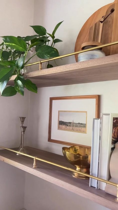 Gold Shelves Kitchen, Floating Shelves With Gold Brackets, Gold Shelf Brackets Kitchen, Oak Shelves Brass Brackets, Vintage Brass Shelf Rail, Shelves With Brackets Living Room, Open Shelves With Brass Rail, Shelves With Brass Railing, Long Shelves On Wall Kitchen