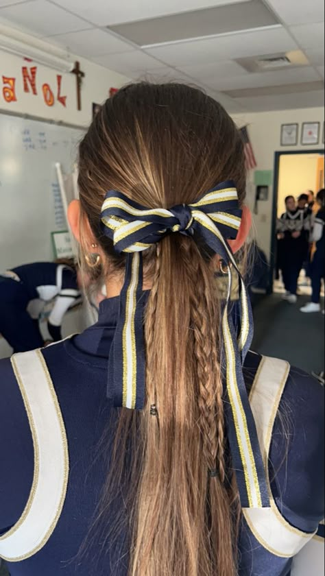 Braid Cheer Hairstyles, Softball Ribbon Hairstyles, Cute Low Ponytails For Cheer, Cute Cheer Hairstyles For Short Hair, Pep Rally Hairstyles Cheer Hair, Cute Hairstyles Cheer, School Cheer Hairstyles With Bows, Mini Braids Ponytail, Low Cheer Ponytail With Bow