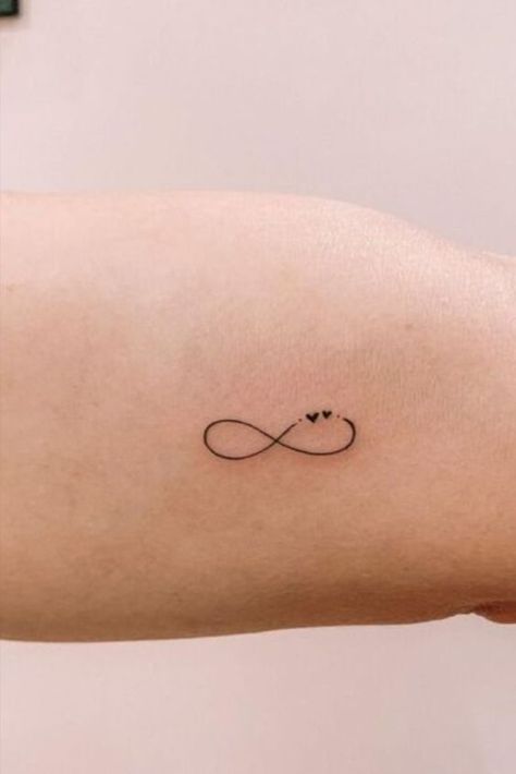 23 Small Tattoos For Women That Are Meaningful & Stylish Infinity Tattoo Unique, Simple Infinity Tattoo Designs, Tiny Matching Tattoos Sisters Meaningful, Small Fun Tattoos For Women, Small Matching Tattoos Sisters, Small Sister Tattoos With Meaning, Tattoo Designs Infinity, Patient Tattoo, Stay Tattoo