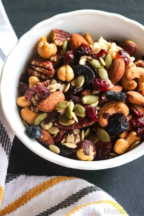 Close up view of trail mix with nuts, seeds and dried fruit in white bowl Healthy Trail Mix Recipes, Energy Boosting Snacks, Healthy Trail Mix, Trail Mix Recipes, Homemade Trail Mix, Gluten Free Banana, Summer Snacks, Easy Snack Recipes, Healthy Homemade