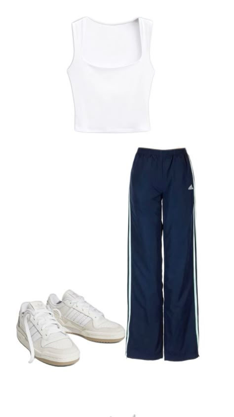 Embrace the sporty chic vibe with this effortlessly cool outfit! Navy Adidas track pants offer a comfortable yet stylish fit, paired with a simple white crop tank for a fresh, clean look. Complete the outfit with crisp white Adidas Forums to tie it all together. Perfect for running errands, lounging, or casual outings, this ensemble combines athletic wear with street style for the ultimate laid-back yet trendy look. #SportyChic #AdidasTrackPants #CropTank #AdidasForums #StreetStyle #Athleisure #CasualOutfit #OOTD Adidas Forums, Navy Track Pants, Track Pants Outfit, Outfit Navy, Navy Adidas, White Crop Tank, Adidas Track Pants, Cool Outfit, Adidas Track