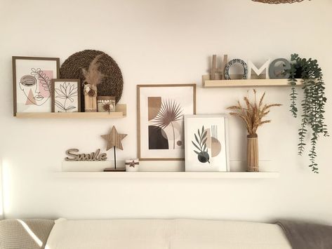 28 Best Wall Decor Ideas To Decorate Your Blank Wall - Foyr Welcome Home Wall Decor, Picture Shelf Aesthetic, Photo Shelves Bedroom, Three Shelves Above Couch, Decoration Wall Living Room, Three Shelves On Wall, Lounge Wall Shelf Ideas, Floating Shelves With Frames, Walls With Shelves Living Room