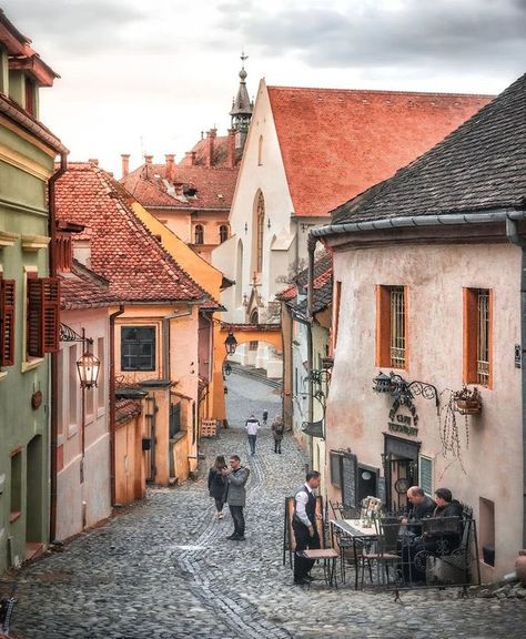 Sighișoara, Romania 🇷🇴 : WalkableStreets Cartoon Architecture, Old City Street, Eastern Europe Aesthetic, Romanian Architecture, Vertical City, Planning Trips, Sidewalk Cafe, Romania Travel, Apartment Buildings