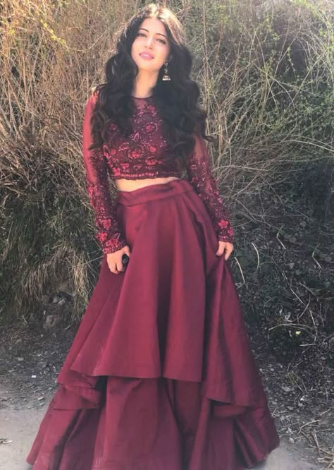 Charlie Chauhan in Kalki maroon double layer skirt with embroidered crop top blouse Crop Top Outfits Indian, Prom Dress Long Sleeves, Charlie Chauhan, Double Layer Skirt, Long Skirt And Top, Indian Outfits Lehenga, Layer Skirt, Lehnga Dress, Lehenga Blouse Designs