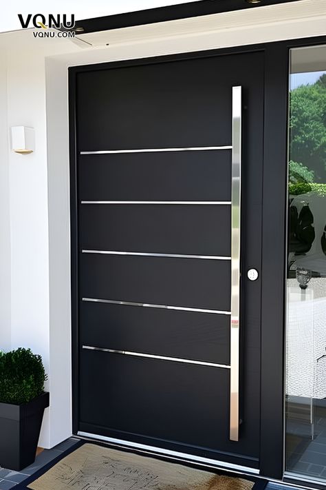 A sleek front door with a matte black finish, horizontal metal accents, and a contemporary handle, perfect for modern home exteriors. Black Entrance Door Modern, Modern House Front Door Iron, Iron Front Door Double Modern, Black Modern Front Door Lowe's, Modern Front Door Design, Front Door Modern Solid Steel, Front Door Design Ideas, Door Design Ideas, Front Door Inspiration