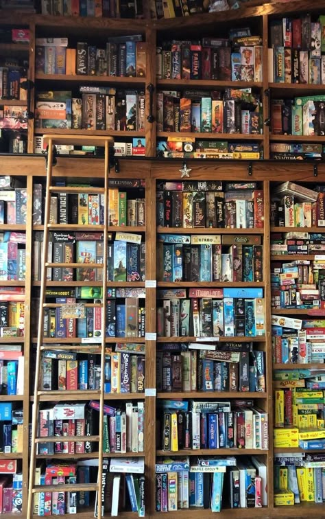 Board Game shelves Board Game Library Room, Board Game Living Room Ideas, Bookshelves Board Games, Game Shop Aesthetic, Board Games Shelf, Board Game Shelving, Board Game Library, Board Game Shop, Boardgame Shelf Ideas