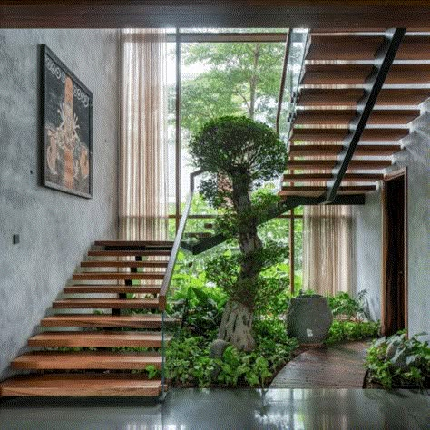 Modern Tropical Stairs, Internal Courtyard With Stairs, Indoor Garden Stairs, Courtyard Staircase Design, Staircase In Courtyard, Tropical Stairs, Stairs Modern Design, Staircase With Plants, Tropical Staircase