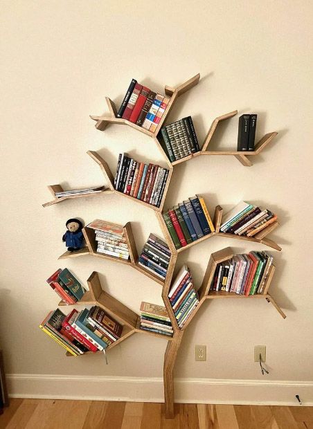 The Best Tree Bookshelves - BOOKGLOW Wooden Library Design, Wooden Tree Bookshelf, Diy Tree Bookshelf Plans, Library Room Ideas School, Book Tree Shelf, Tree Bookshelf Diy, Diy Tree Bookshelf, Tree Bookshelves, Tech Bedroom