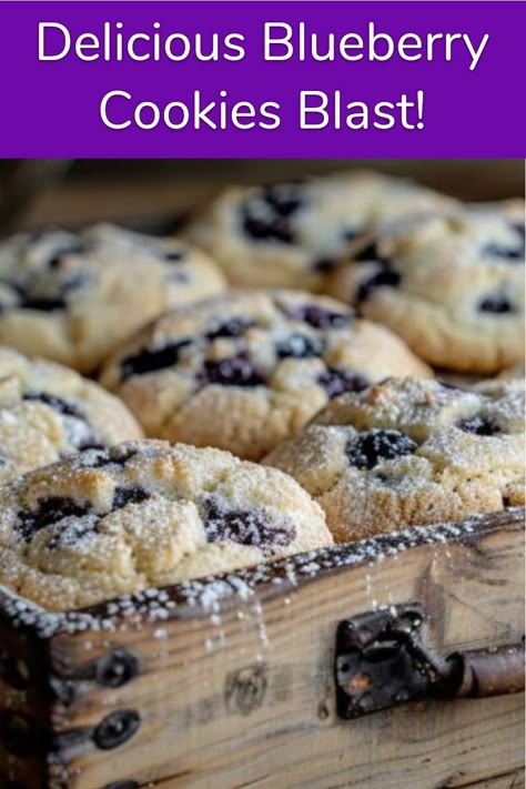 A tray of freshly baked blueberry cookies dusted with powdered sugar. Taste Of Home Blueberry Cookies, Blueberry Cream Cookies, Blueberry Cookies Recipes Easy, Blueberry Cake Mix Cookies, Blueberry Chocolate Chip Cookies, Blueberry Cookies Easy, Blueberry Pie Cookies Recipe, Dried Blueberry Cookies, Blueberry Cookie Recipes