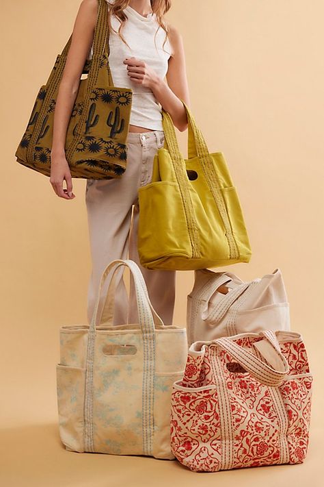 Carry it all in this roomy tote, featured in a classic canvas fabrication with built-it top handles and contrast-seamed shoulder straps. **Features:** Tote style, canvas fabrication, spacious interior, 3 exterior pockets, built-in top handles, contrast-seamed shoulder straps **Why We | Caravan Canvas Tote Bag by FP Collection at Free People in Yellow Canvas Grocery Bag, Patchwork Tote Bags, Unique Tote Bag, Textile Bag, Diy Bags Patterns, Tote Bags Sewing, Fabric Tote, Tote Bag Pattern, Fabric Bags