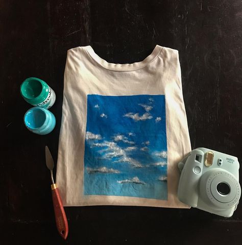 Giulietta-Tenné on Instagram: “Head in the clouds ☁️ Hand painted T-shirt! I love blue sky so I tried to catch it for you! Do you like it? Acrylic on T-shirt 💙” Acrylic Paint On T Shirt, Acrylic Painting On T Shirts, Paint On Tshirt Acrylic, Tshirt Painting Ideas Acrylics, Gf Activities, Painting Shirt Ideas, Painting On Clothes T Shirts, T Shirt Painting Ideas Acrylics, Diy T Shirt Ideas Paint