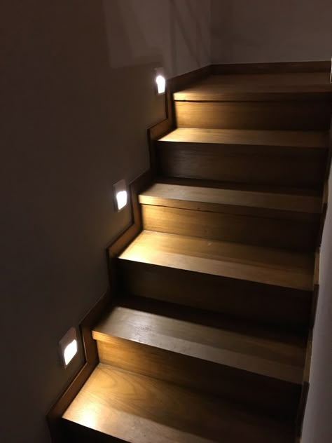 Hang mason jar sconces on the stair wall and insert LED fairy lights inside the jars. This rustic-chic décor adds warmth and ambiance to the space. DIY Tip: Drill holes in the lids of mason jars to thread the fairy lights through. Attach the jars to wooden plaques and hang them using wall hooks.  #Tags:  #StairDecor #LEDLights #InteriorDesign #DIYDecor #HomeImprovement #WallDecor #LightingIdeas #HomeDIY #CreativeDecor #StaircaseDesign Stair Case Lights Ideas, Staircase Design Modern Luxury, Wall Decor With Lights, Stairs Wall Decor Ideas, Stairs Wall Design, Lights Stairs, Lights For Stairs, Stairs Wall Decor, Unique Stairs