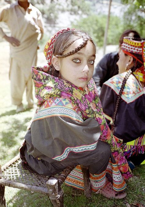 The Kalash are fascinating. Kalash people are a non-Muslim aboriginal minority living on the fringes of northern Pakistan, the only ones not following the religion in all of Pakistan. Their genetic makeup is so pure and distinct, that they are unlike other human races, thanks to their evolving DNA and rare alleles. Their isolation have helped them to preserve their culture.  Even more interesting, most don't look Caucasian like this girl, but their gene pool creates great variation. North Pakistan, Folk Costume, World Cultures, People Of The World, Interesting Faces, Anthropology, Little People, People Around The World, Beautiful Eyes