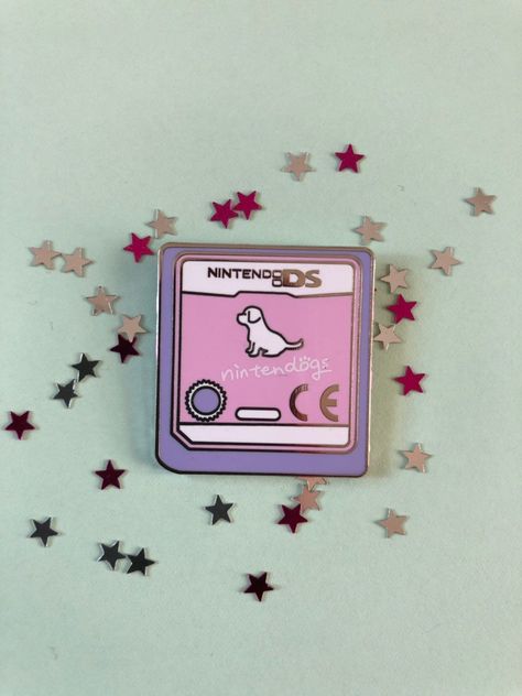 Adorable enamel pin badge featuring the Nintendogs game cartridge. Perfect for any Nintendo fan! #nintendogs #nintendo #gamer . #Fimo #Enamel_Pin_Collection #Backpack_Pins #Jacket_Pins Enamel Pin Collection, Backpack Pins, Jacket Pins, Bag Pins, Pretty Pins, Game Cartridge, Patches And Pins, Enamel Lapel Pin, Pins And Patches