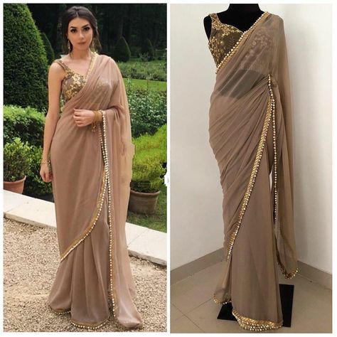 Buy now at 1350/- only. Shop this beautiful outfit for upcoming festivals. FABRICS DETAILS SAREE FABRIC: GEORGETTE SAREE WORK : MOTI LACE BORDER SAREE SIZE: 5.5 MTR BLOUSE FABRICS : BANGLORI SILK BLOUSE WORK : CHAIN STITCH WORK BLOUSE SIZE : 1 MTR #weddingdress #vocalforlocal#dressup #dressoftheday #dressing #dressmaker #dresscode #dresslover #ankaradress #dresses #fashion #dress #style #onlineshopping #fashionista #fashionblogger #instafashion #shopping #women #unlock3.0#lockdown #womensfashion Walima Saree, Lehenga Choli Ideas, Choli Ideas, Designer Fancy Sarees, Saree With Lace Border, Traditional Dresses Indian, Gold Saree Blouse, Saree Blouse Ideas, Gold Saree