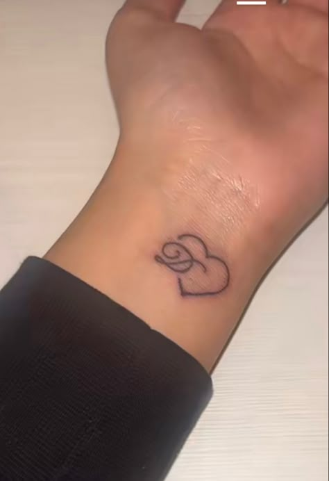 Small Loved One Tattoo, Tattoo On Wrist Black Women, Cursive D Tattoo With Heart, Cute Simple Wrist Tattoos, Initial Tattoo Black Women, Under Buttcheek Tattoo Black Women, Last Name Tattoos For Men On Back, Private Area Tattoos, Small Boyfriend Name Tattoos For Women