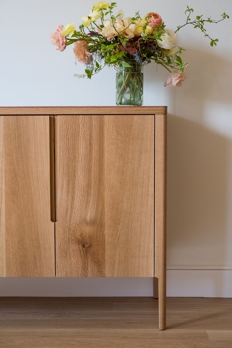 The Harvest Sideboard is designed to house glassware, spirits, and accoutrement. The front features hand-sawn veneered doors with integrated pulls. The top is clad in hand finished, full-grain leather - a material chosen for its natural beauty and texture only enhanced by age and wear. Natural Finish Furniture, Furniture Details Design, Wooden Cabinet, Wooden Door Design, Side Board, Wooden Sideboard, Oak Sideboard, Wood Cabinet, Sideboard Designs