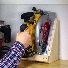 Learn how to make a DIY circular saw storage holder with these step-by-step plans. This space-saving DIY holder is the perfect way to store a circular saw in your workshop. This is a simple afternoon project that can be made with a few simple cuts, a few common tools, and a few pieces of scrap wood. Get the easy-to-follow plan now! Circular Saw Storage, Saw Storage, Door Remodel, Shop Hacks, Woodshop Ideas, Lazy Man, Diy Locker, Backyard Barn, Garage Organizing