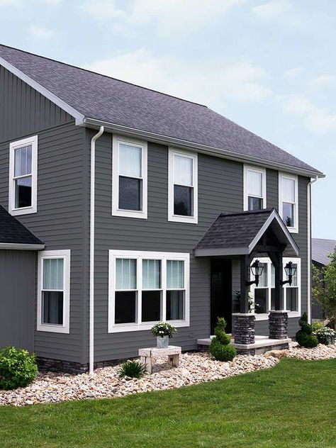 Slate gray exterior vinyl siding idea | These Classic Vinyl Siding Colors Deliver Curb Appeal for Years Dark Grey Vinyl Siding, Grey Vinyl Siding, Vinyl Siding House, Siding Colors For Houses, Vinyl Exterior Siding, Exterior Siding Options, Vinyl Siding Colors, Exterior House Siding, Grey Siding