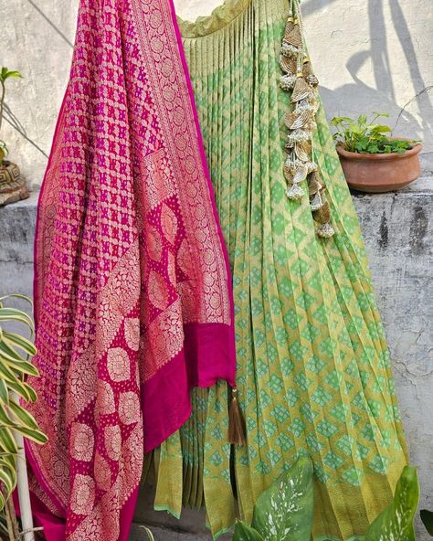 ***SOLD***INR 36500 Pure Banarsi Georgette bandhani lehenga. This three-piece set consists of a stitched lehenga, an unstitched blouse piece, and a beautiful Banarsi georgette bandhani dupatta. Lehenga Length: Approx 44 inch length Lehenga Waist: Approx 34 waist with drawstrings and zip closure on the side. Lehenga/ Ghagra has a single layer of Cancan and a double layer of lining. Lehenga Fabric: Pure Banarsi Georgette Blouse Fabric: Pure Banarsi Georgette Dupatta Fabric: Pure Banarsi Georg... Dupatta With Saree, Bandhani Dupatta Lehenga, Side Lehenga, Bandhani Lehenga, Banarsi Dupatta, Bandhani Dupatta, Lehenga Fabric, Stitched Lehenga, Georgette Dupatta