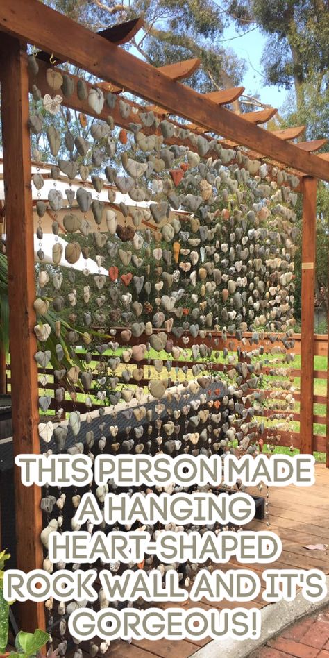 You Won't Believe This Stunning Heart-Shaped Rock Wall—See How They Made It! Rock Display Ideas Diy Garden, Creative Ways To Display Rock Collection, Rock Hanging Decor, Heart Rock Display Ideas, How To Display Rocks Outside, Diy Rock Wall Landscape, Heart Rock Garden, How To Display Rocks Collection, Outdoor Rock Display Ideas Diy