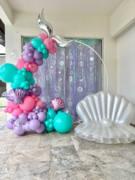 Making a little girls dream come true with mermaid balloons from Organically Arched Mermaid Theme Balloon Garland, Mermaid Birthday Balloon Ideas, Mermaid Birthday Balloon Arch, Mermaid Back Drop Ideas, Mermaid Theme Balloons, Mermaid Party Balloon Arch, Mermaid Birthday Backdrop Ideas, Oneder The Sea Balloon Arch, Mermaid Birthday Balloons