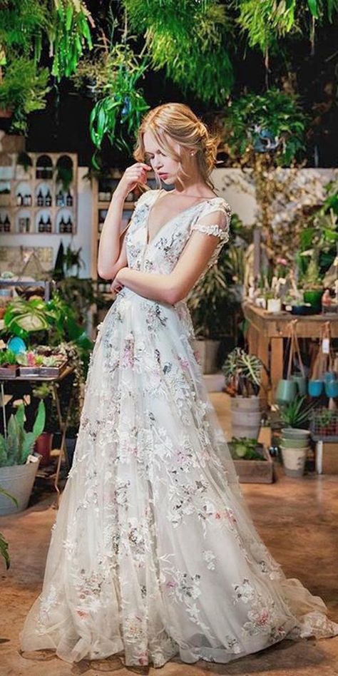 floral wedding dresses a line lace v neckline with short sleeves savin london Wedding Dresses Splash Of Color, Non White Wedding Dress Blushes, White Floral Embroidered Dress, Meadow Wedding Dress, Dreamy Forest Wedding, Fun Wedding Dress, Floral Embroidered Wedding Dress, Floral Wedding Dresses, Embroidered Wedding Dress