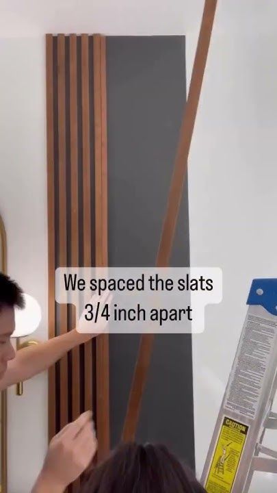 DIY Affordable Wood Slat Accent Wall || Cost Breakdown: Sanded Plywood - $25, Stain - $7 - YouTube Strip Wood Wall, Striped Wood Wall, Black Slat Accent Wall, Slat Wood Panels On Wall Ideas, Diy Wooden Accent Wall, Plywood Slat Wall, Slat Wall Vaulted Ceiling, Farmhouse Slat Wall, Diy Wood Slat Wall Bedroom