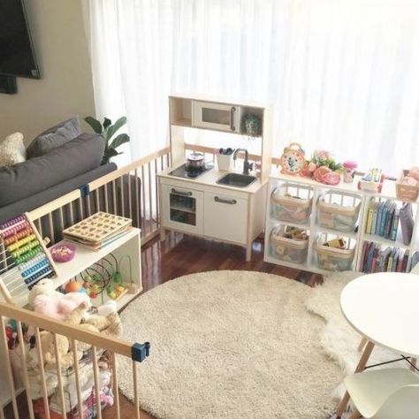 Organised Kids Play Area Idea-this is a simple playpen in our lounge room that I have progressively turned into a mini play room as my daughter got older. Starting small with a rug and a few toys when she was a baby it gradually grew with her through toddlerhood. Featuring Ikea's children's toy kitchen, play food, Eames replica table and chairs, jigsaws and many other fun things! Playpen Ideas, Living Room Play Area, Kids Play Corner, Playrooms Ideas, Large Playroom, Baby Play Area, Kid Friendly Living Room, Play Area Ideas, Baby Play Areas