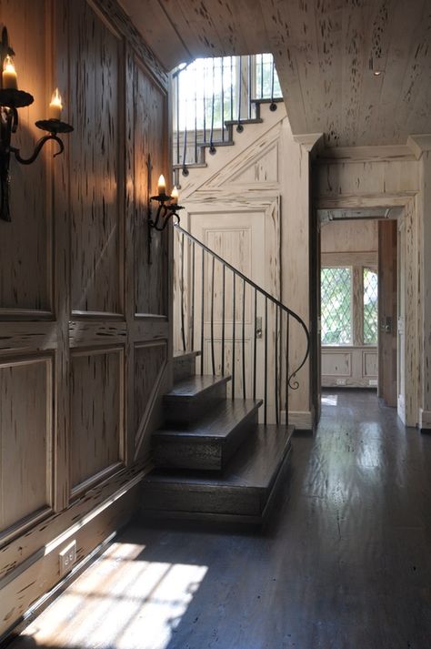 Distressed pecky cypress wormwood paneling. Sans the outdated sconces, I could live with interior walls like this for a lifetime. Pecky Cypress Paneling, Pecky Cypress, Iron Handrails, Traditional Staircase, English Country House, Classical Architecture, House Tour, Old House, Architecture Details