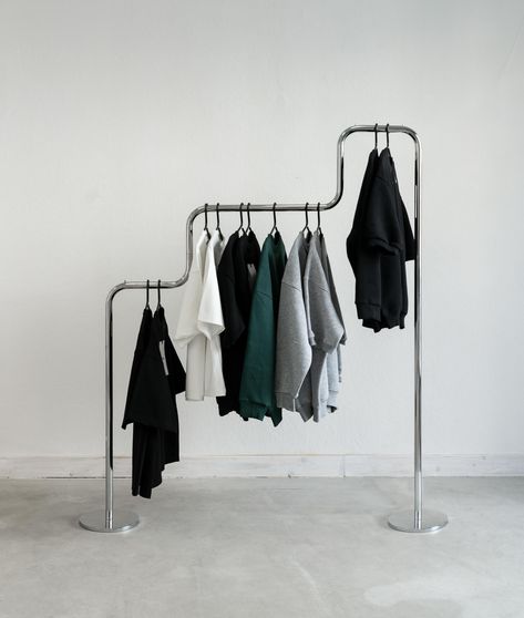 Unique Clothing Rack, Steel Clothes Rack, Showroom Design Fashion, Cool Clothing Rack, Diy Cloth Rack, Clothing Pop Up, Bauhaus Wardrobe, Clothing Rack Design, Clothes On A Rack