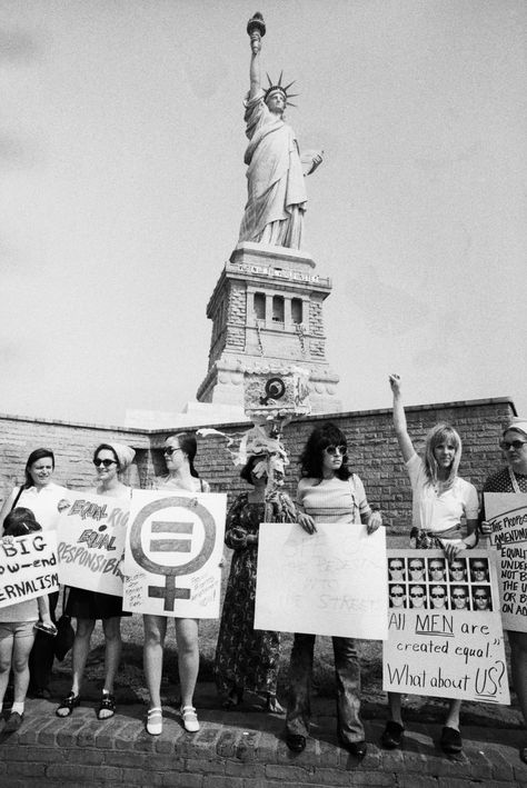 1970 - The Statue of Liberty Has Long Been a Magnet for Protest - A group of women rally at the Statue of Liberty in August, 1970. In the background on the Statue of Liberty reads a banner saying, “Women of the World Unite.” In 1970, feminist Betty Friedan called for a national women’s strike on August 26 to mark the 50th anniversary of the 19th Amendment, which granted U.S. women the right to vote. (Credit: Bettmann Archive/Getty Images). HISTORY Female Empowerment Art, Feminist Protest, Women Empowerment Art, Empowerment Art, Feminist Artist, Feminism Art, Feminist Movement, Riot Grrrl, The Statue Of Liberty