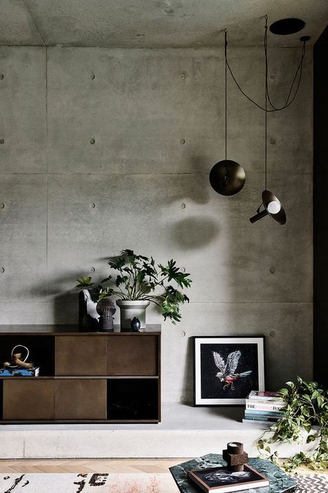 The Rising Popularity of Brutalism in Interior Design Concrete Walls Interior, Brutalism Interior, Moody Neutral, Concrete Interior Design, Brutalist Interior, Grey Living Room, Concrete Interiors, Industrial Livingroom, Industrial Interior Design