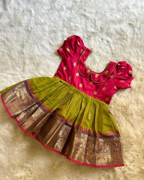 For the next festival, temple visit, wedding and special occasions! Have it all sorted Pinkish Red with Mehendi Green (Vintage Collar)- Kanchi Cotton South Indian Ethnic Frock for Baby Girl Instock: 0-3 Years www.babynmeindia.com 🔎REDMEHGREKCFRO Cotton Frocks For Baby Girl, Ethnic Frocks For Baby Girl, Pattu Langa For Baby Girl, Pattu Frocks For Baby Girl, Baby Girl Indian Dress, Baby Green Dress, Traditional Dress For Baby Girl, Baby Girl Dresses Indian, Langa Designs