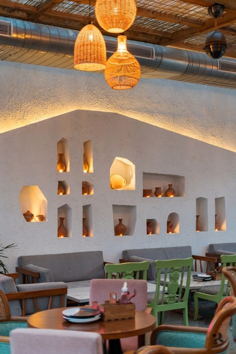 Café Design that Uses Contemporary Mediterranean Ambience and Industrial Décor | Projected Rays Design - The Architects Diary Mediterranean Restaurant Design, Industrial Decor Projects, Mediterranean Cafe, Yellow Restaurant, Terrace Cafe, Pizzeria Design, Restaurants Design, Mediterranean Interior Design, Contemporary Mediterranean