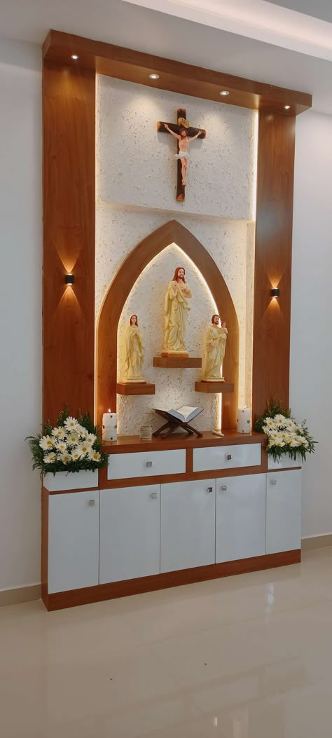 Lighting, Prayer Room, Storage Designs by Interior Designer Joju Mj, Thrissur | Kolo Catholic Home Altar Ideas Living Rooms, Large House Plants, Christian Room Decor, Home Altar Catholic, Prayer Room Ideas, Tall Indoor Plants, Catholic Altar, Altar Design, Catholic Decor