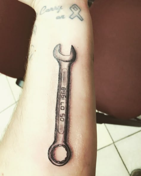 Wrench tattoo Wrench Finger Tattoo, Tattoo Tools Mechanic, Memorial Wrench Tattoo, Wrench With Flowers Tattoo, Mechanic Memorial Tattoo, Wrench Tattoo Design, Wrench Tattoo Mechanic, Toolbox Tattoo, Diesel Mechanic Tattoo