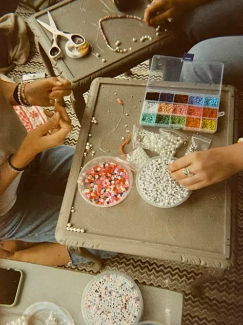 Camp Necklace Craft, Bead Making Aesthetic, Craft Core Aesthetic, Making Bracelet Aesthetic, Making Crafts Aesthetic, Craft Making Aesthetic, Birthday Crafts Aesthetic, Friends Making Bracelets Aesthetic, Bead Crafts Aesthetic